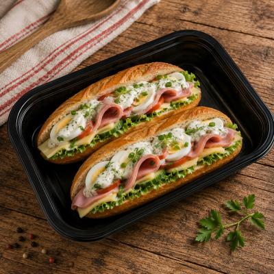 Plněné bagety s máslem, šunkou, sýrem, vejcem, čerstvou zeleninou a bylinkovým dresinkem, 350g celá porce, 120,- Kč